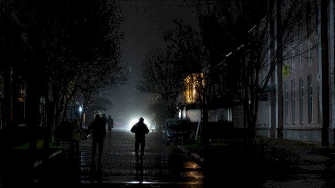 in-the-dark-and-under-fire,-ukraine-strains-to-keep-the-lights-on